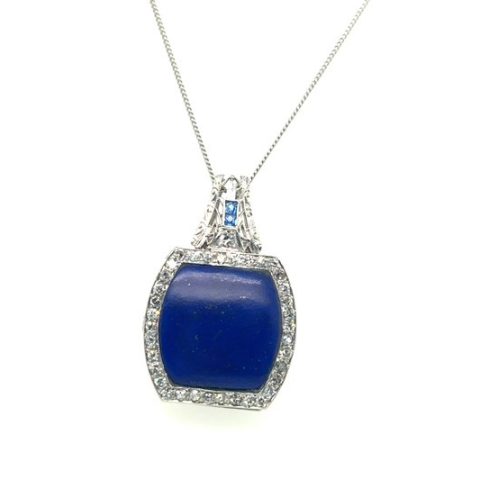 Platinum lapis lazuli and single-cut diamond Art Deco watch face case pendant, 7.24 ct lapis lazuli, 0.48 CTW diamond accents