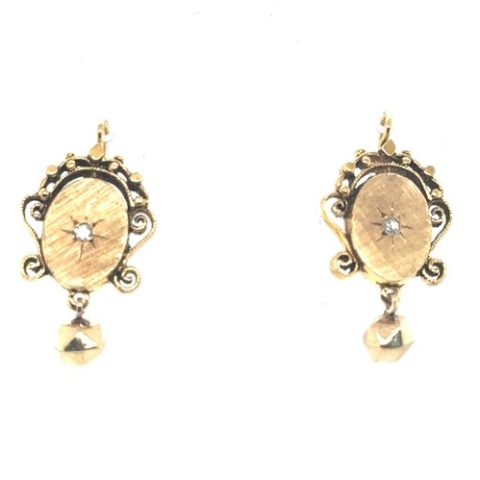 14K yellow gold French-cut diamond Victorian Etruscan Revival drop earrings, approx. 0.09 CTW starburst star-set diamond centers, brushed oval panels with scrollwork and granulation frames, approx. 6mm faceted gold ball drops, shepherd's hook wire backs, 6.65 grams