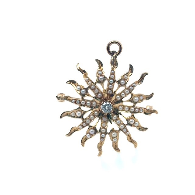 14K yellow gold Victorian diamond and seed pearl wavy sunburst brooch/pendant, 0.20 ct G-H/SI star-set diamond center, graduating seed pearl rays, open-work construction, loop bail and pin back, 1¼" diameter, 5.2 grams