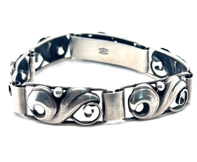 Sterling silver scroll and leaf link bracelet signed John Lauritzen, 7.5 inches