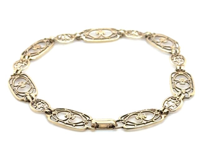 10K yellow gold Art Deco open-work link bracelet, seven rectangular heart and foliate scroll links alternating with six cushion flower links, fold-over clasp, 7.5" length, 8.5mm wide, 5.06 grams, sold as is