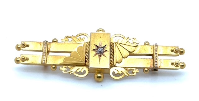 15K yellow gold old mine cut diamond late Victorian bar brooch, star-set diamond center cartouche, Aesthetic Movement fan and scrollwork flanking motifs, applied bead and rope detailing, ball terminal finials, pin back