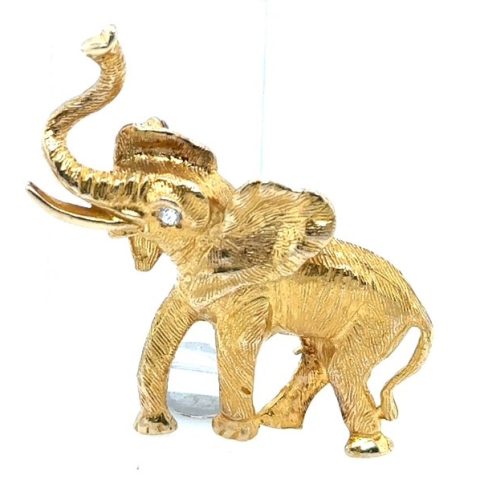 14K yellow gold figural elephant brooch with raised trunk, old mine cut diamond eye accent, approx. 0.05 ct, engraved fur-texture surface, pin back, 1¾" x 1½", 11.4 grams, 1970s–1980s