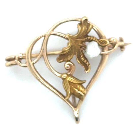 10K yellow gold seed pearl Art Nouveau watch pin, open-work pointed oval frame with sculpted foliate and botanical motifs, scrollwork tendrils, seed pearl accent, loop bail and pin back, 1⅛" x 1", circa 1890–1910