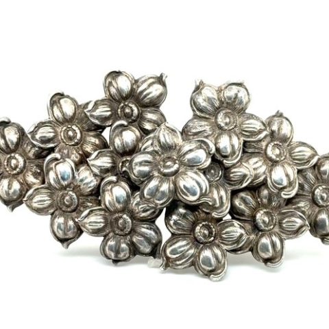 Sterling silver repousse dogwood blossom belt buckle, 1940-1950s