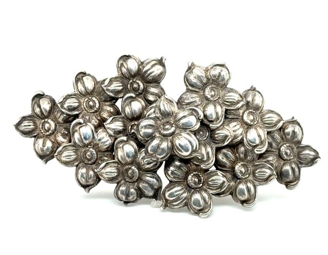 Sterling silver repousse dogwood blossom belt buckle, 1940-1950s