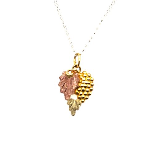Vintage 10K tri-color gold Black Hills grape and leaves pendant by Landstrom's