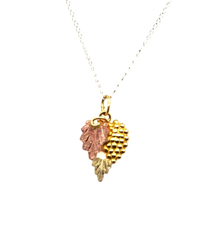 Vintage 10K tri-color gold Black Hills grape and leaves pendant by Landstrom's