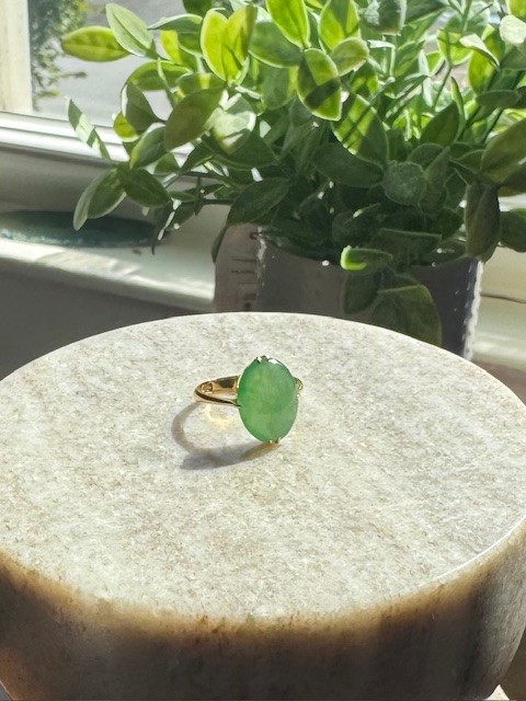 14K yellow gold solitaire ring with oval green dyed jadeite