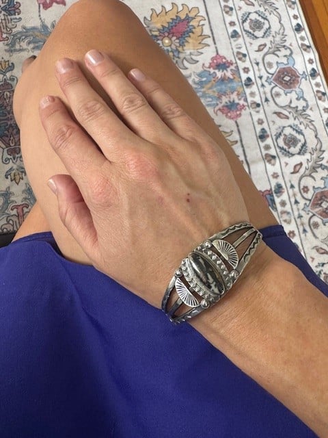 Native American sterling silver cuff bracelet with bezel set petrified wood and stamped fan details